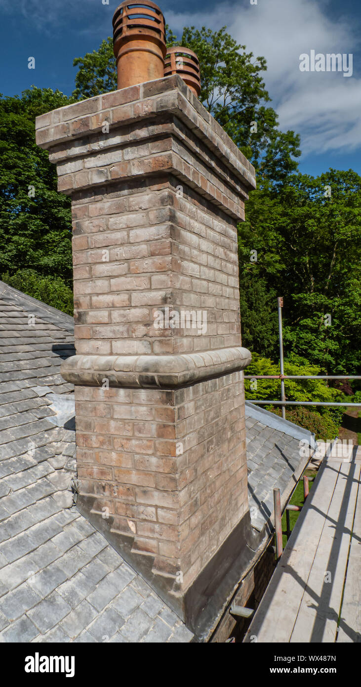 Close up of chimney stack after being re-pointed and with new lead flashing. Stock Photo