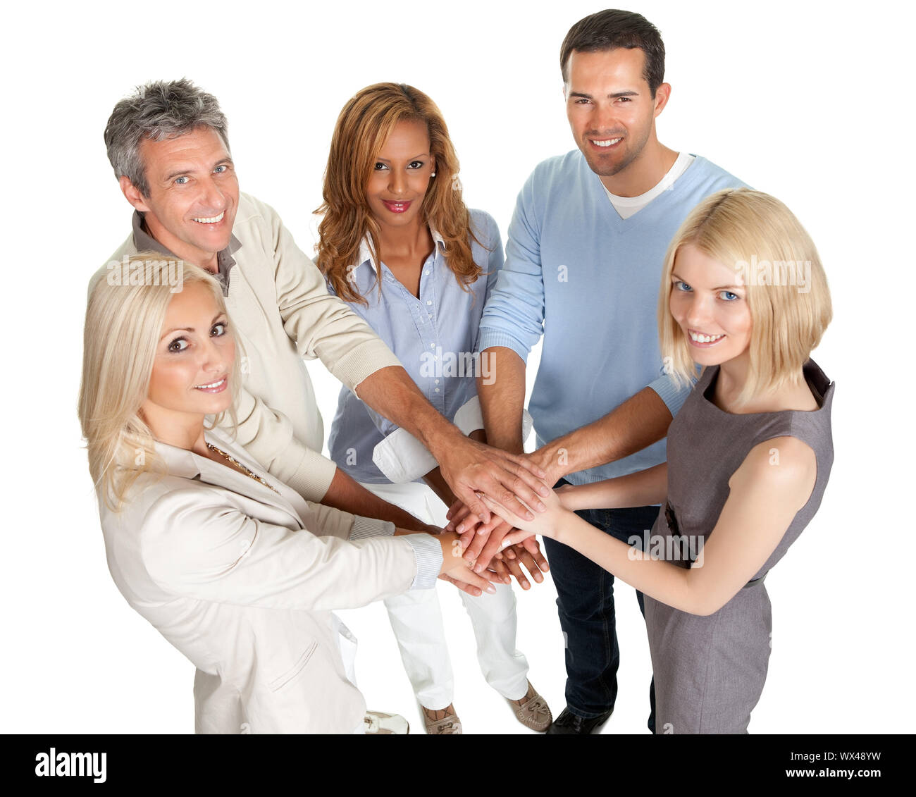 Group of people stacking their hands together isolated on white ...
