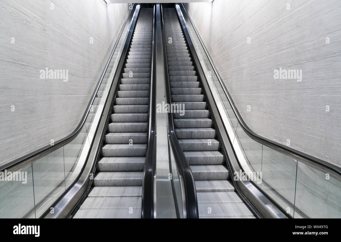empty long escalator in a train station Stock Photo