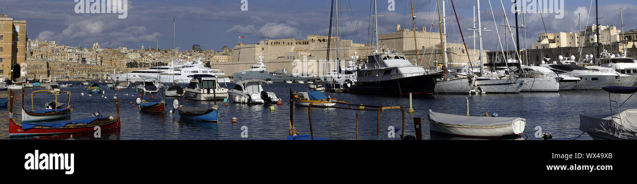 View from Senglea over the marina on Fort St. Angelo in Vittoriosa, in the background Valletta Stock Photo
