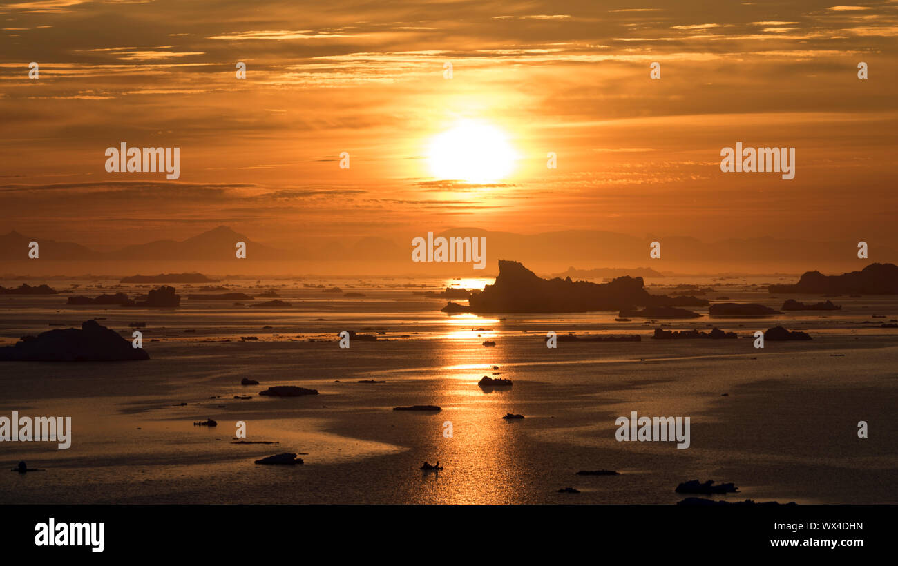 Sunbeam reflection on the arctic ocean in greenland Stock Photo