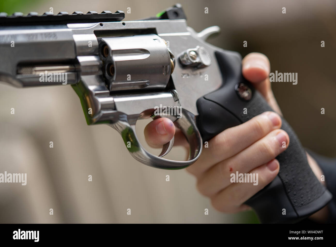man playing russian roulette with magnum 44 revolver handgun model released  Stock Photo - Alamy