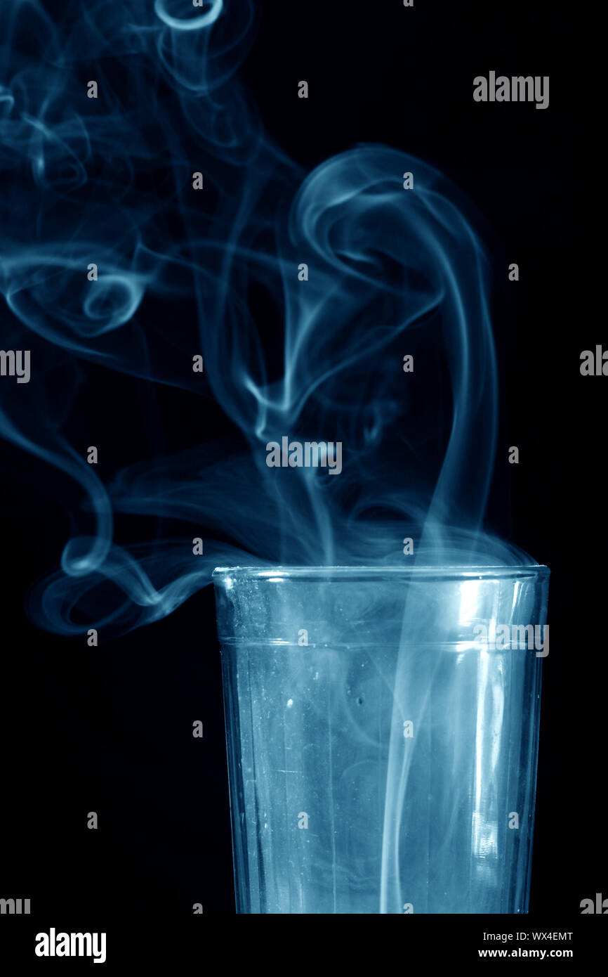 glass and smoke on black background Stock Photo