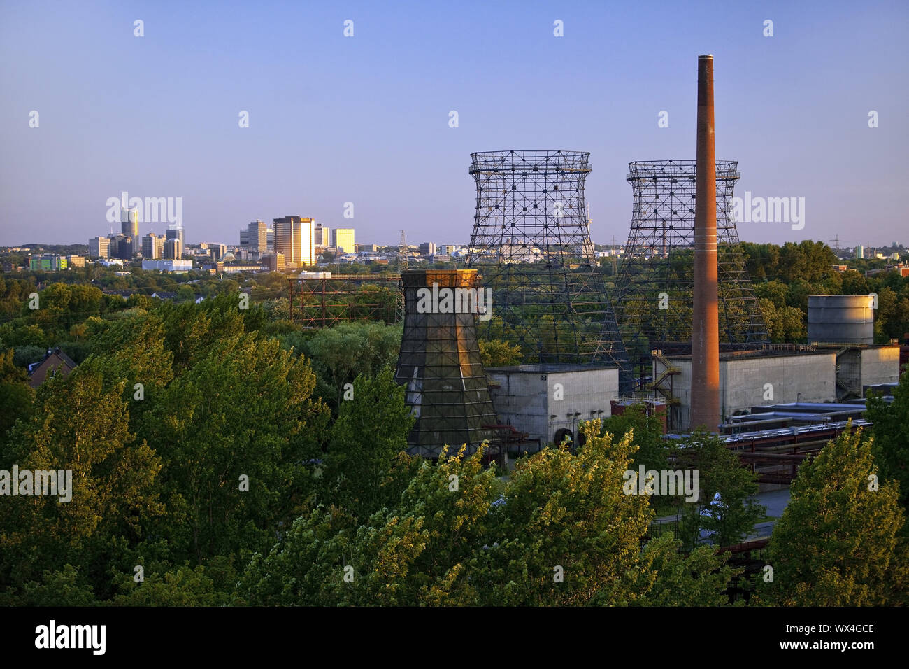 Cooling towers of the Zollverein coking plant and the skyline of the city centre, Essen, Germany Stock Photo