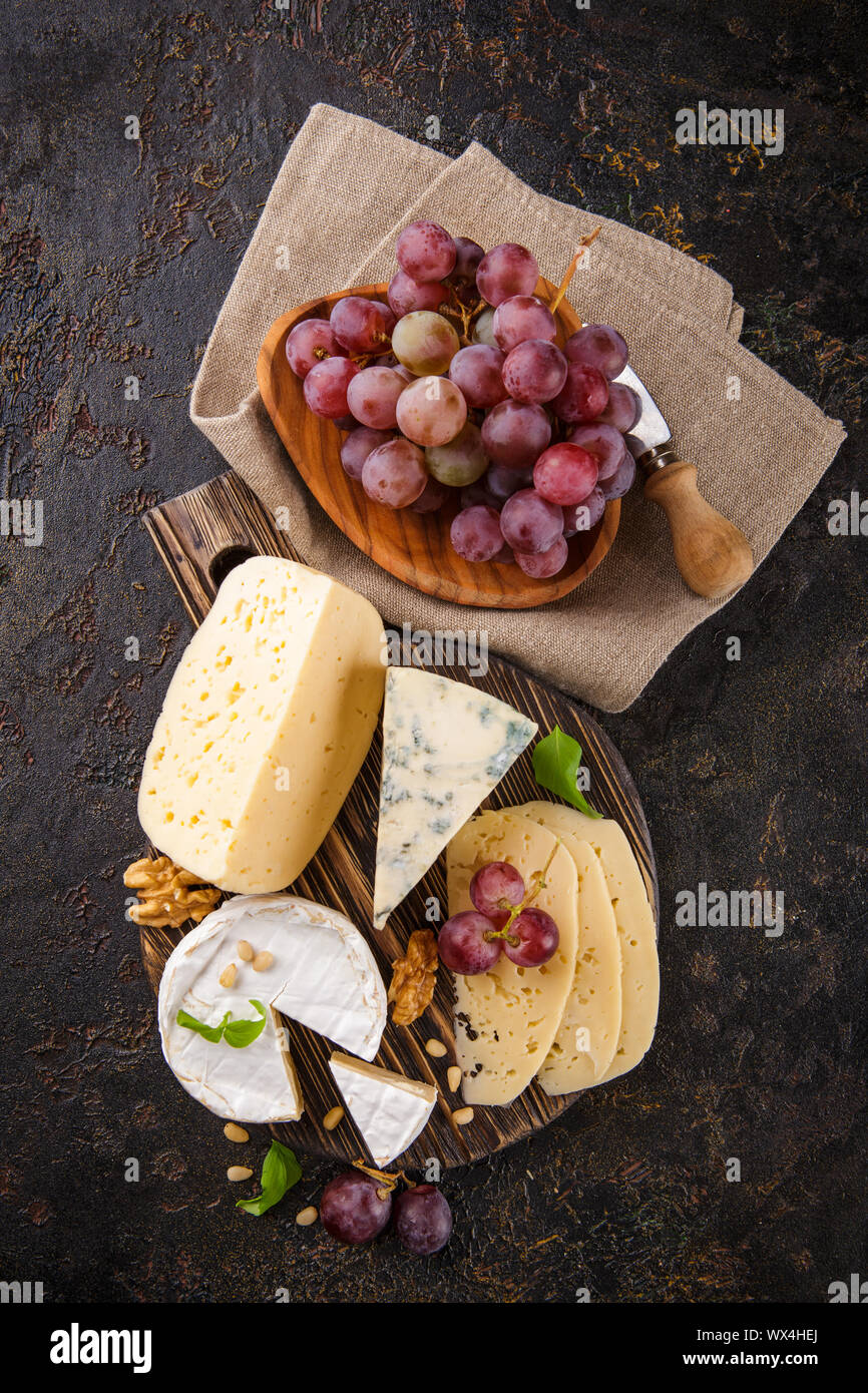 Cheese with nuts and grapes Stock Photo Alamy