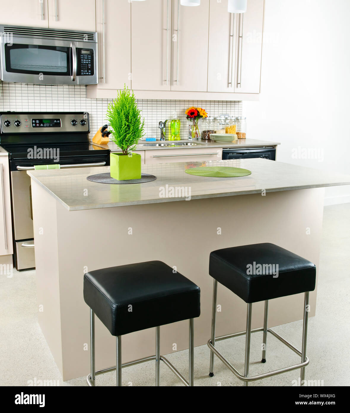 Modern kitchen interior with island and natural stone countertop Stock ...