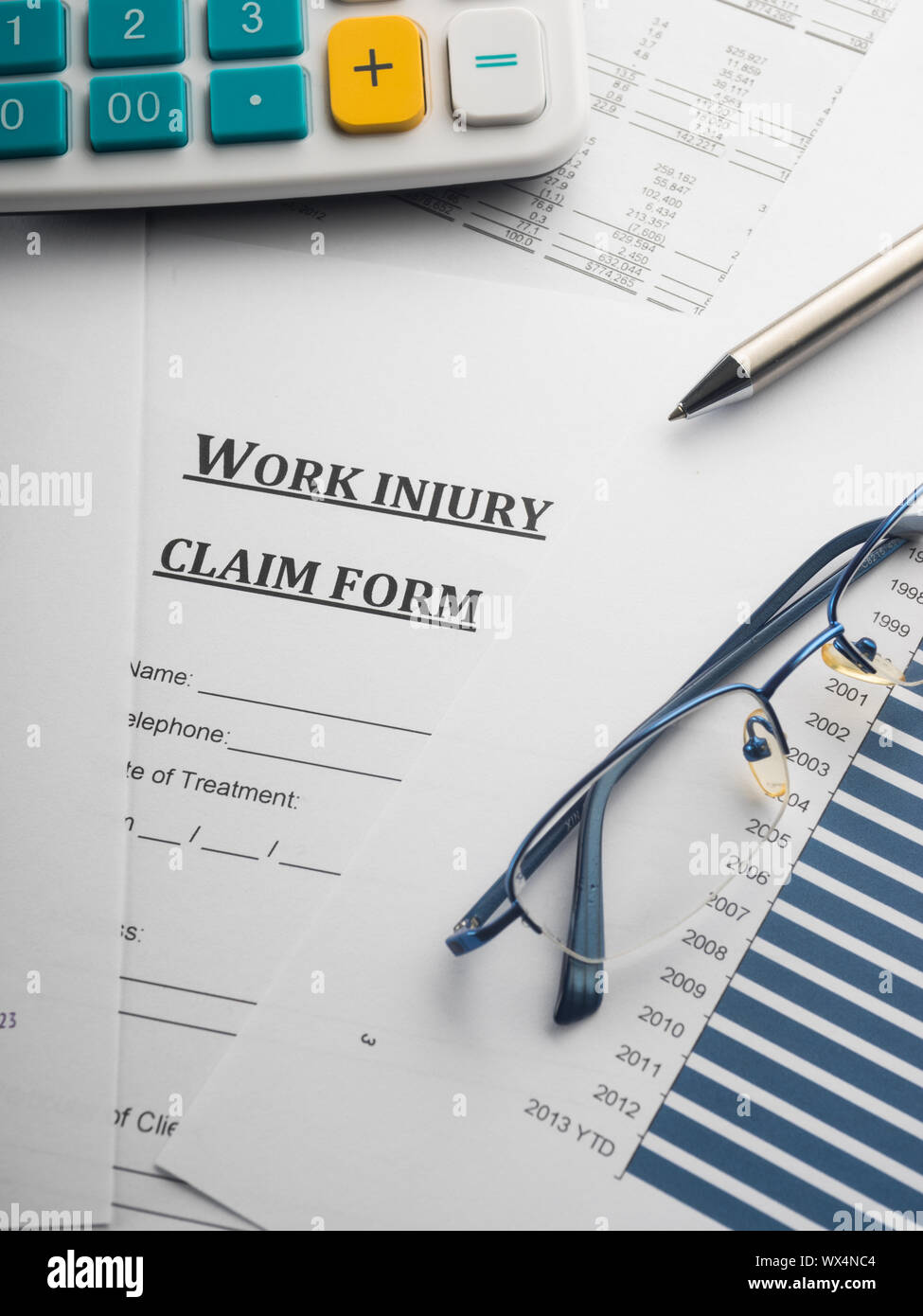 work injury claim form on desk Stock Photo Alamy