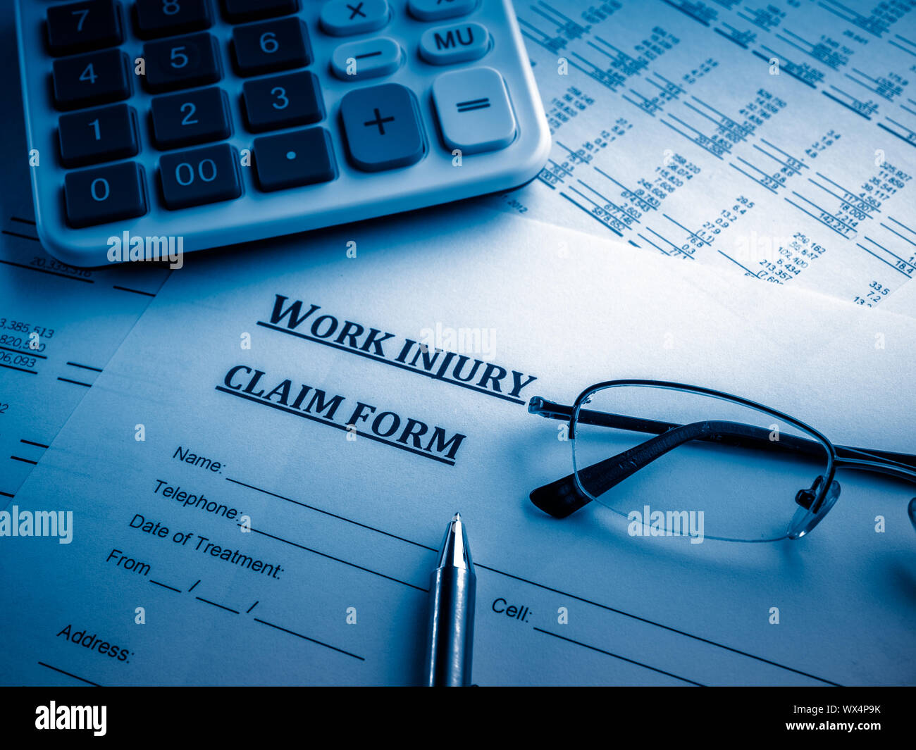 work injury claim form on desk Stock Photo Alamy