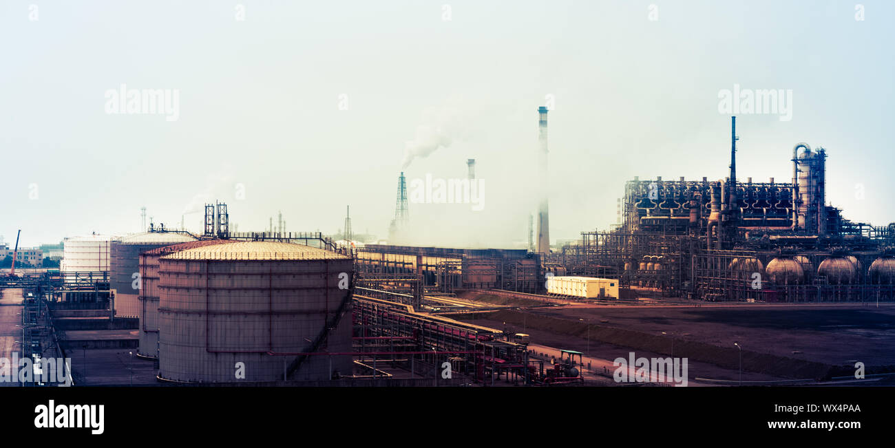 refinery with smoke stacks Stock Photo