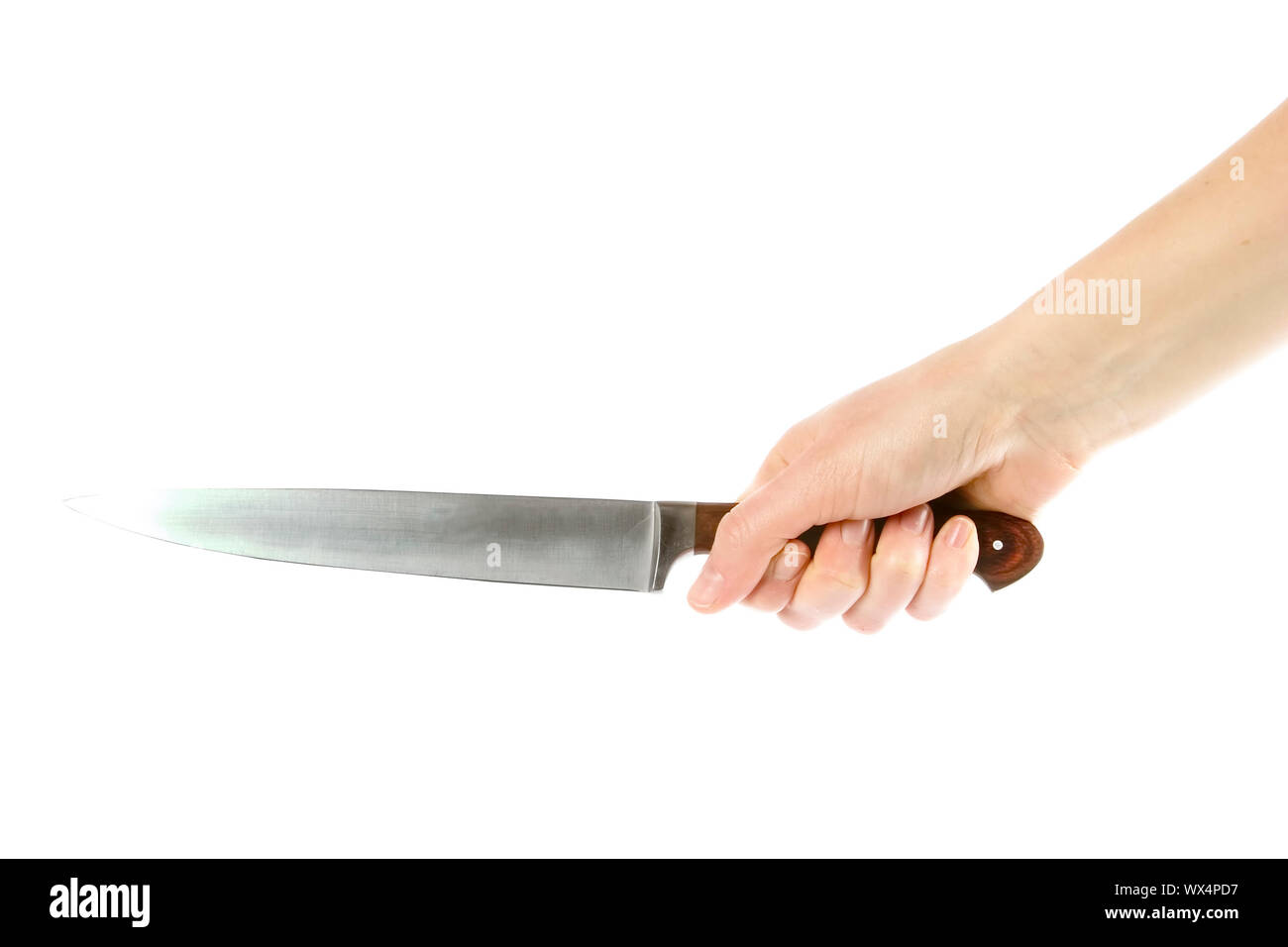 A hand holding a large butcher knife isolated on white with clipping path. Stock Photo