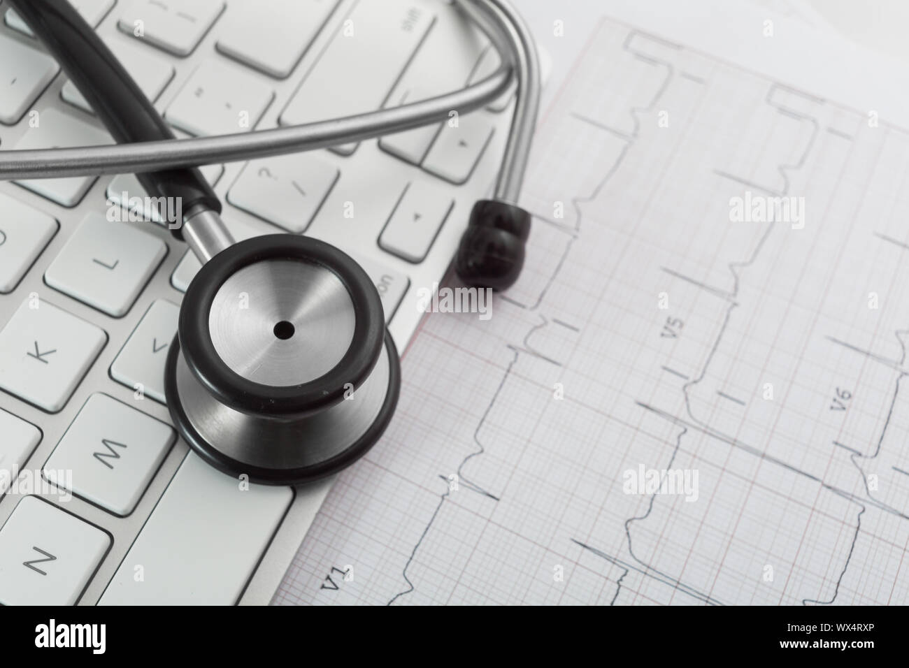 Stethoscope on cardiogram concept for heart care Stock Photo