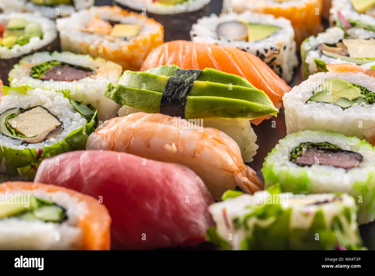 Assortment of japanese sushi rolls nigiri sashimi and maki Stock Photo ...