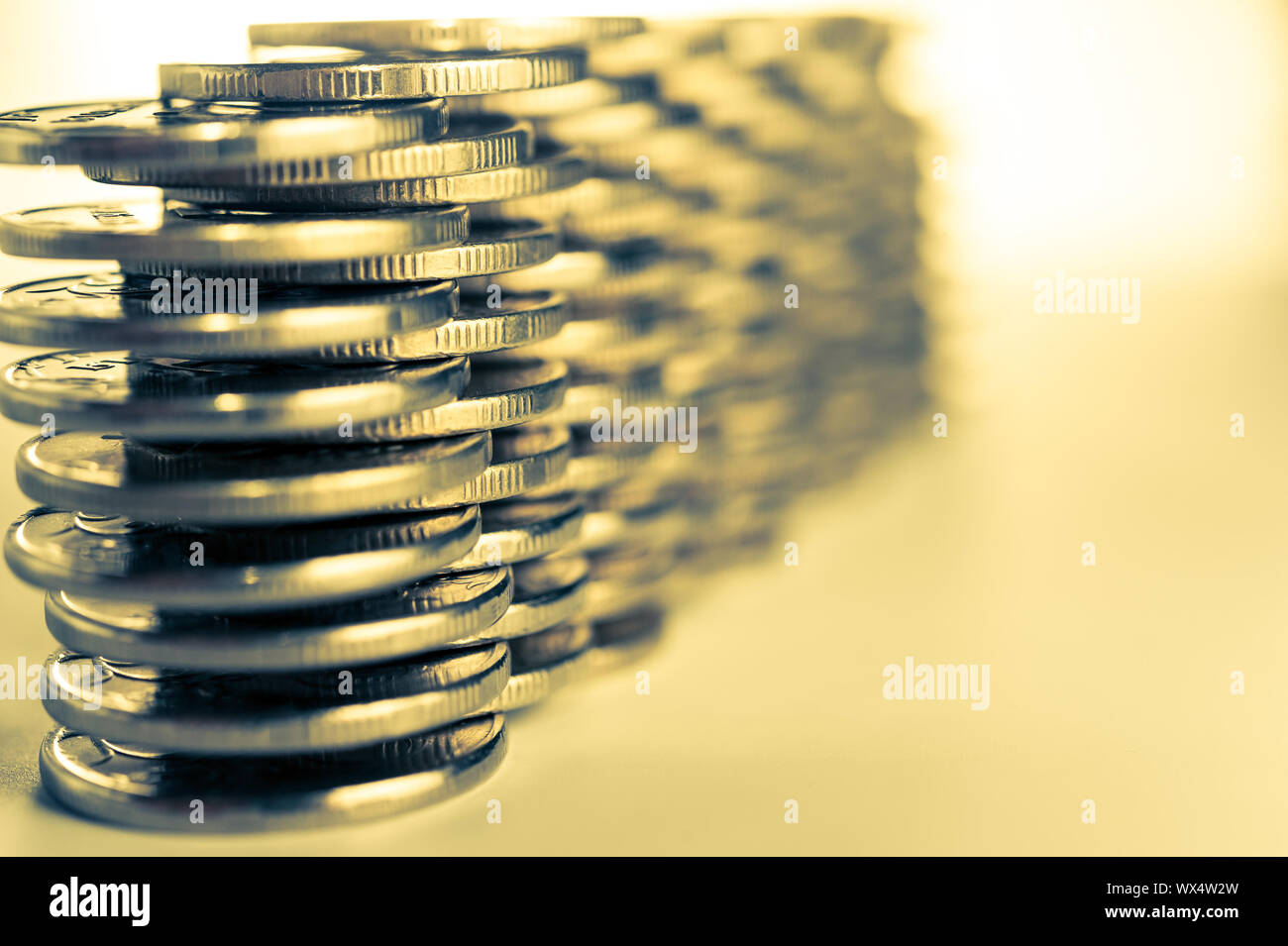 Stack of golden coins macro. Rows of coins for finance and banking concept. Economy trends background for business idea. Stock Photo