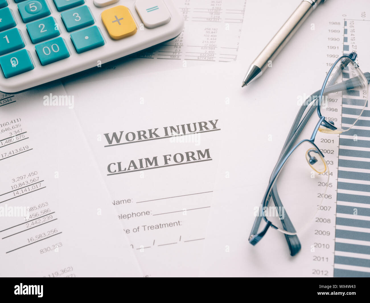 work injury claim form on desk Stock Photo Alamy