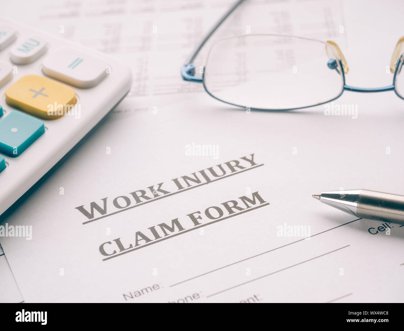 work injury claim form on desk Stock Photo Alamy
