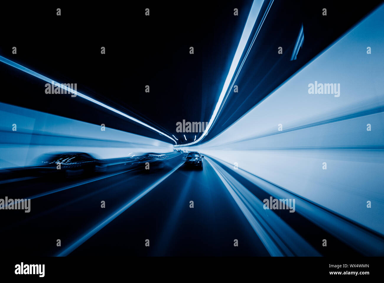 speeding car through tunnel Stock Photo