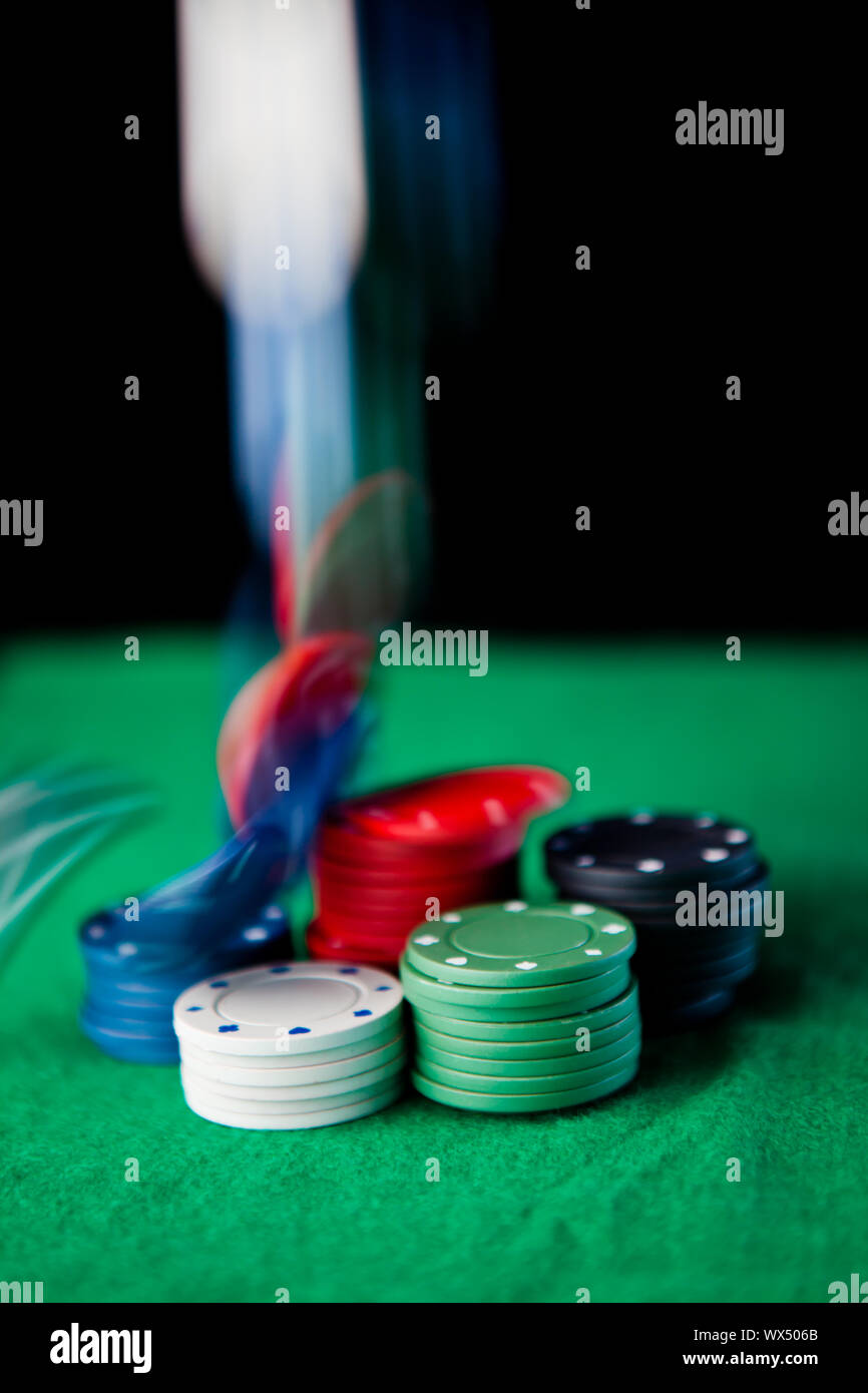 Drop of chips against a black background Stock Photo - Alamy
