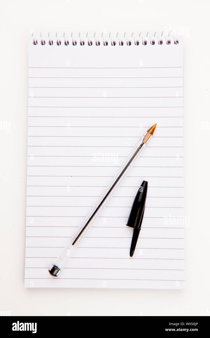 Notepad  with black pen sheet  against a white background Stock Photo