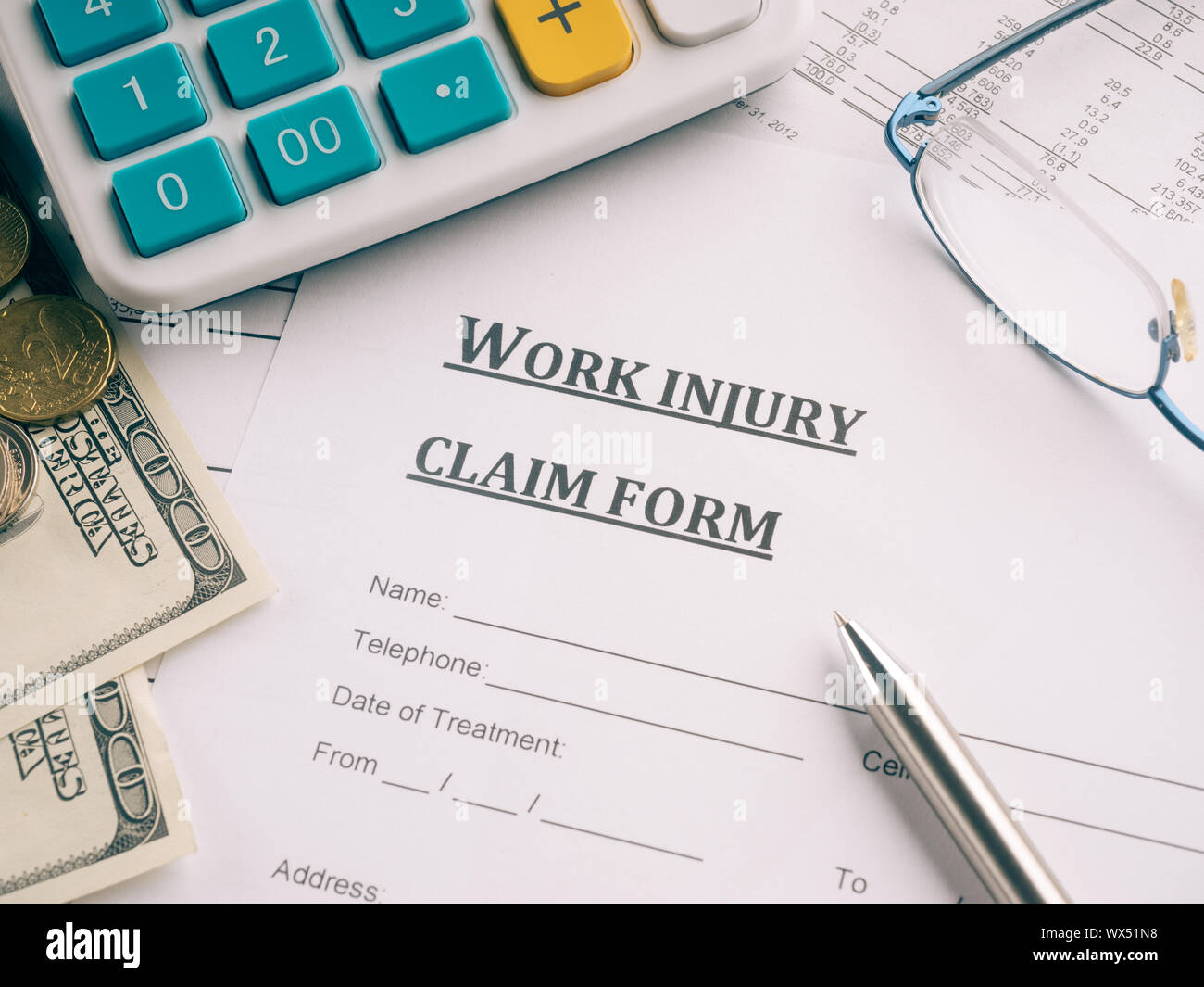 work injury claim form on desk Stock Photo Alamy