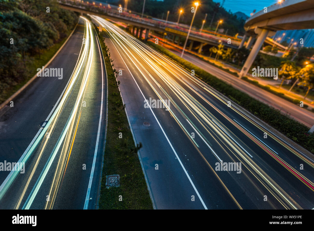 city busy traffic at dusk Stock Photo