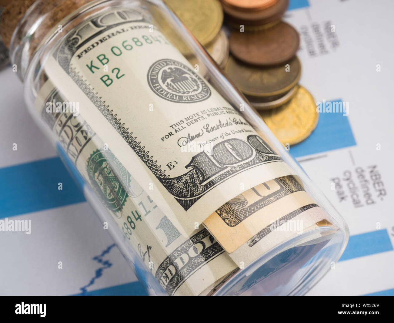 dollar in the bottle on desk. Stock Photo