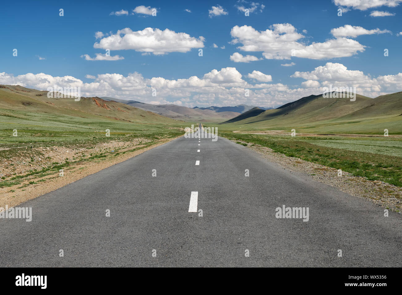 Empty asphalt road in Mongolia between mongolian towns Tsagaannuur and Bayan-Olgii Stock Photo