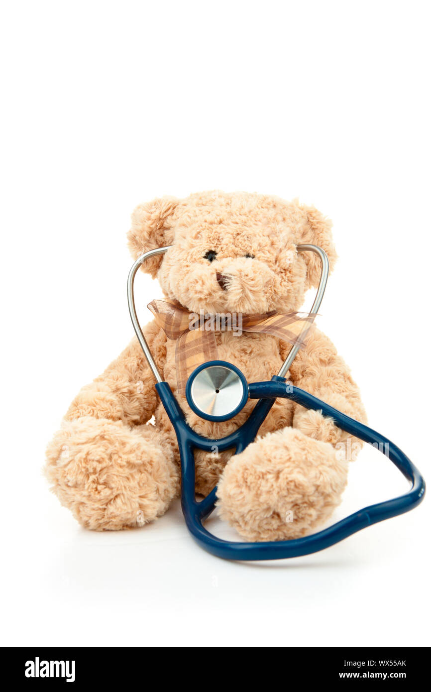 Teddy bear with a stethoscope against a white background Stock Photo