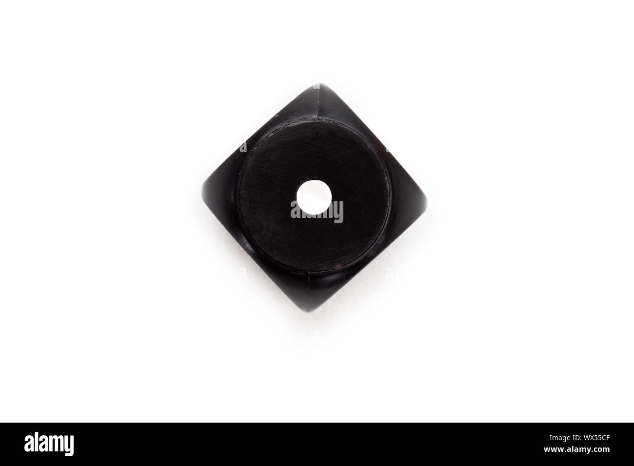Black dice against a white background Stock Photo