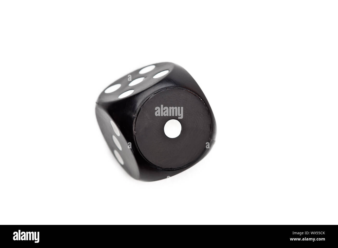 Black dice moving against a white background Stock Photo