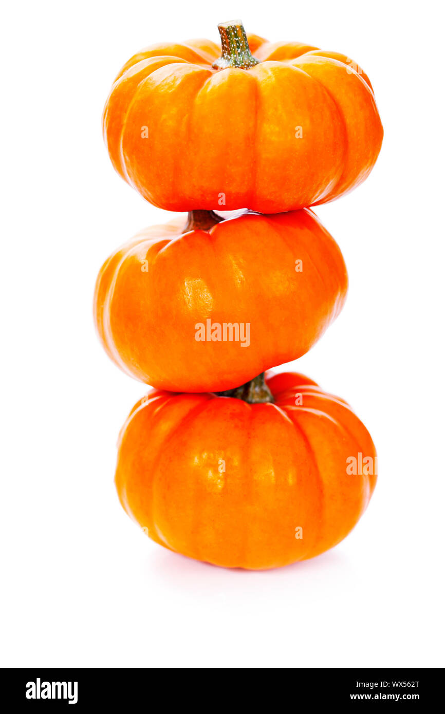 Three stacked mini pumpkins over white Stock Photo