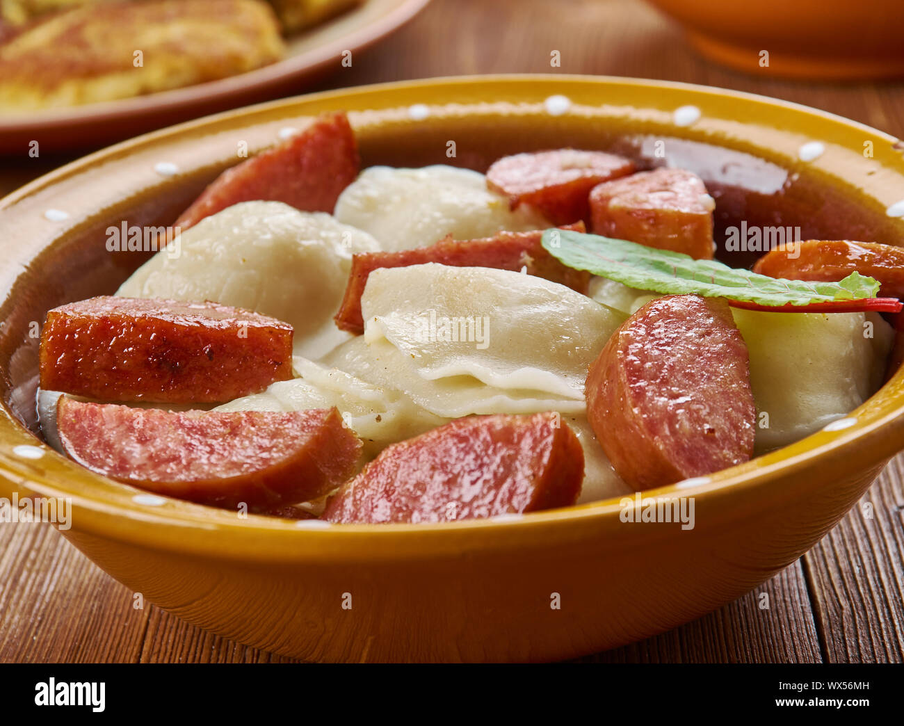 https://c8.alamy.com/comp/WX56MH/crockpot-pierogi-casserole-with-kielbasa-WX56MH.jpg
