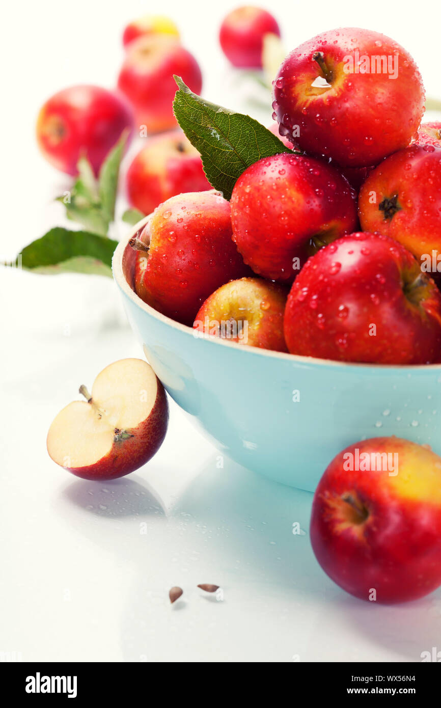Fresh apples in a bowl over white Stock Photo