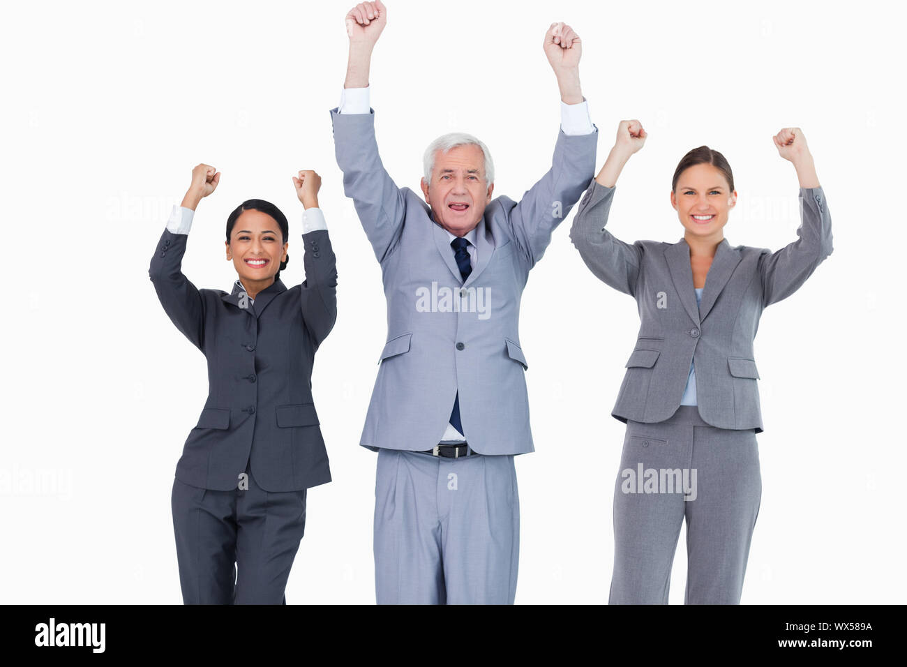 Three cheering businesspeople against a white background Stock Photo
