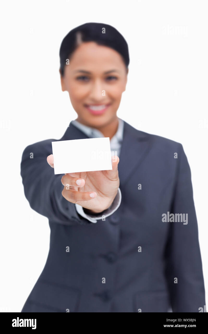 Close up of business card being shown by saleswoman against a white