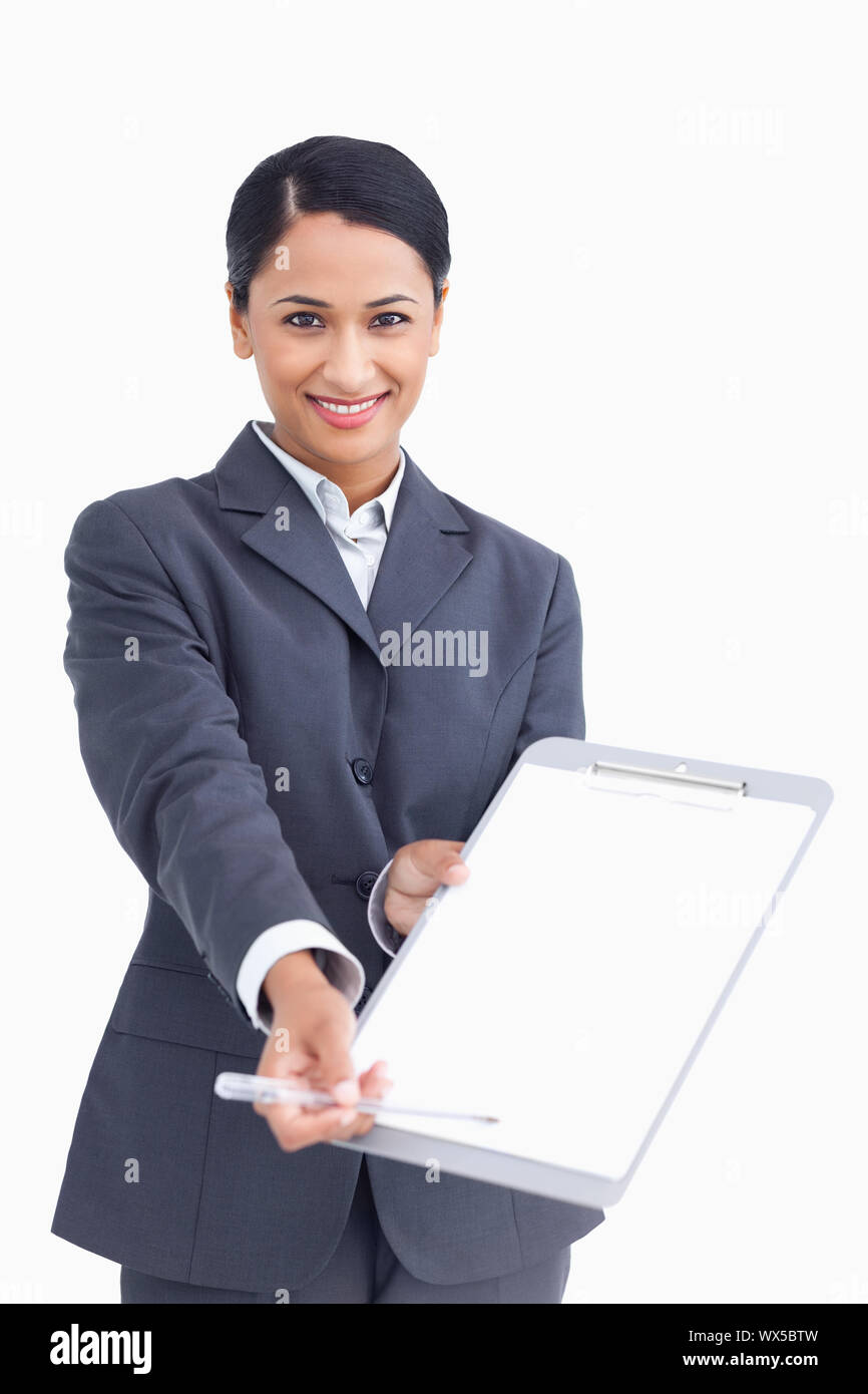 Close up of smiling saleswoman asking for signature Stock Photo