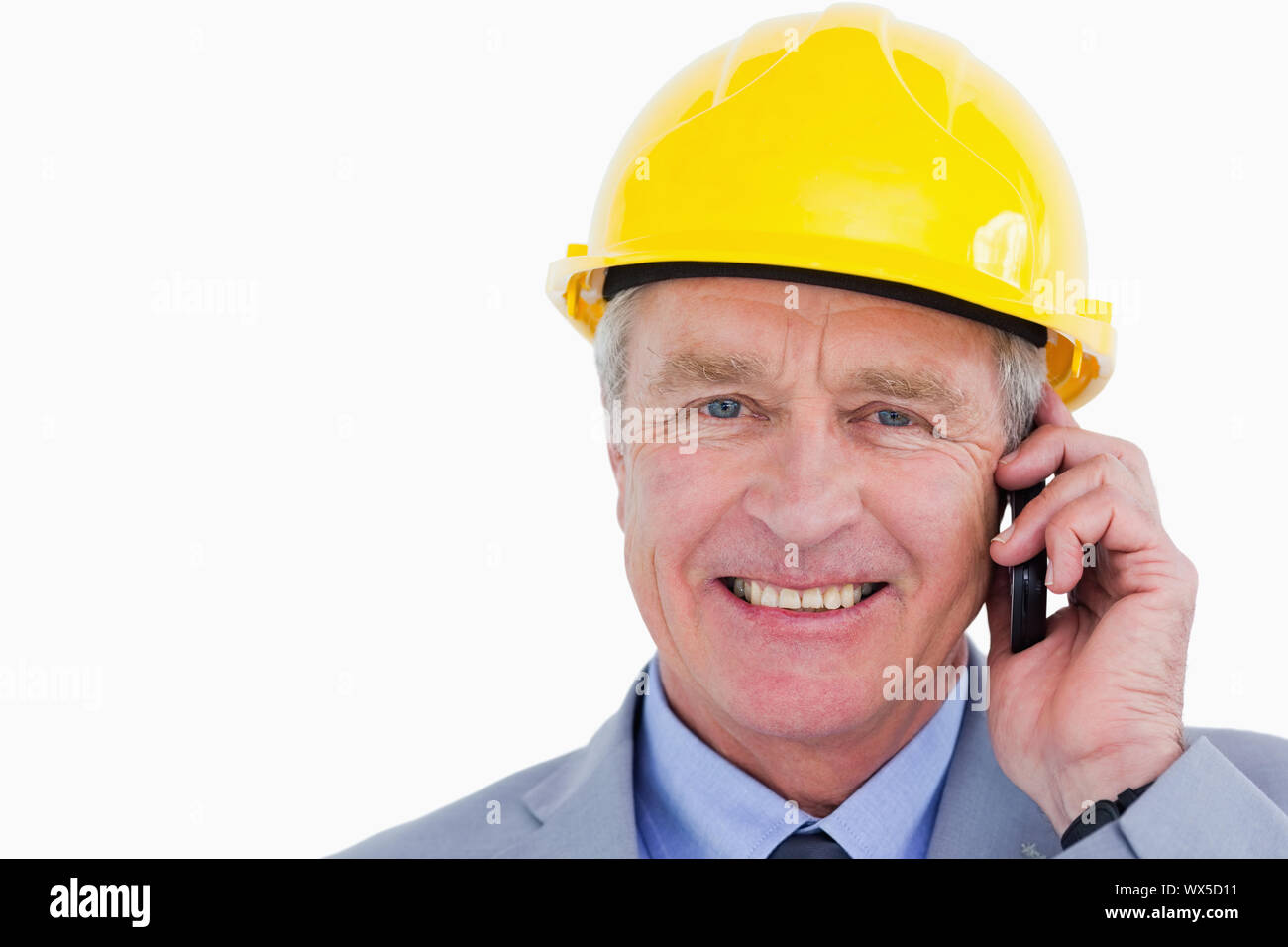 Smiling mature architect on the phone Stock Photo