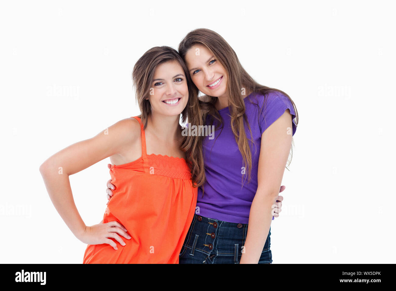 Teenagers holding each other by the waist while smiling Stock Photo - Alamy