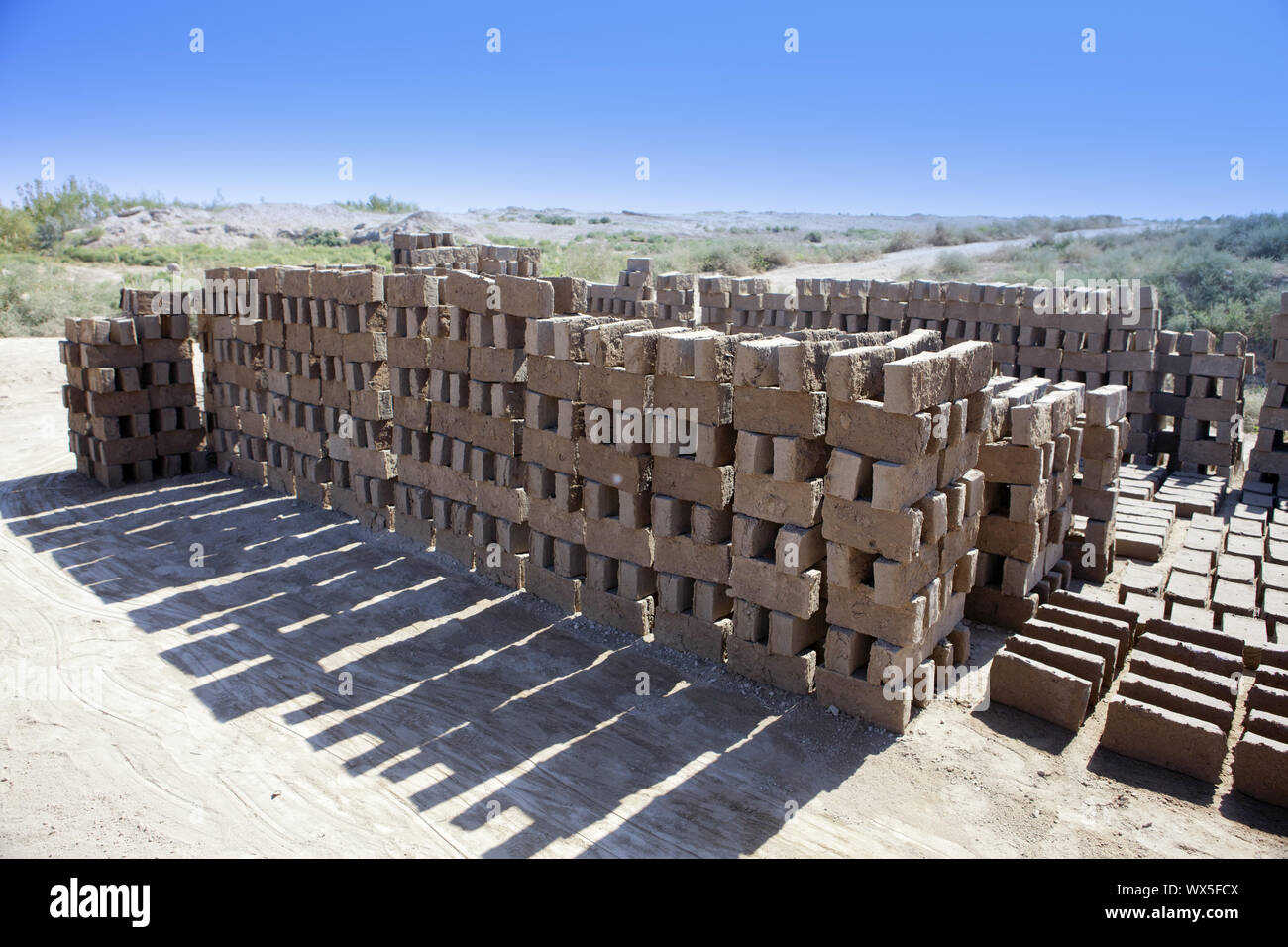 handmade clay bricks for Kyzyl-kala fortress repair in Kyzylkum Desert, Uzbekistan Stock Photo
