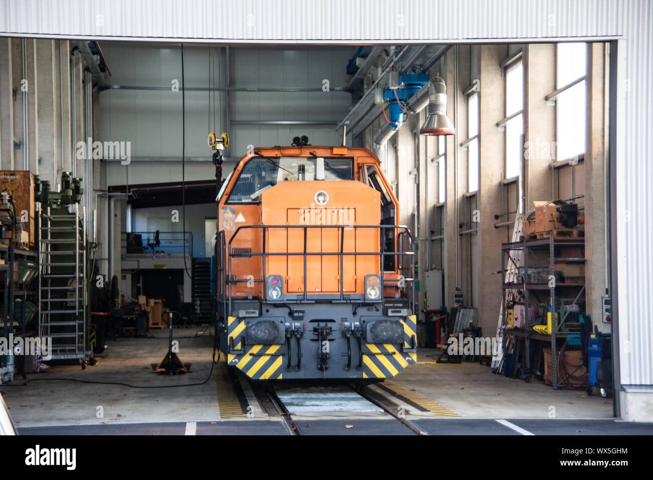 orange diesel loco in the shed Stock Photo
