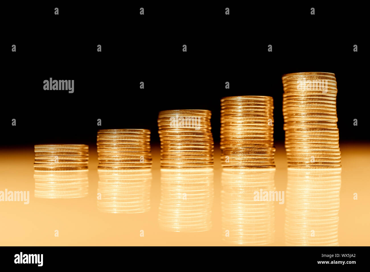 Stack of gold coins macro. Rows of coins for finance and banking concept. Economy trends background. Stock Photo