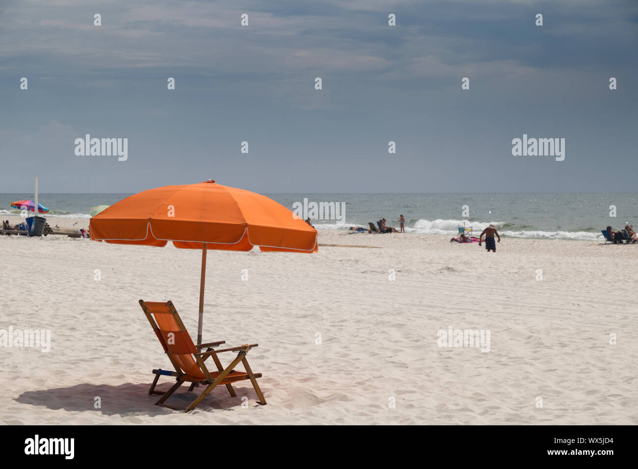 Umbrella and beach chair on the Gulf of Mexico beach at Gulf Shores, Alabama, USA. Stock Photo