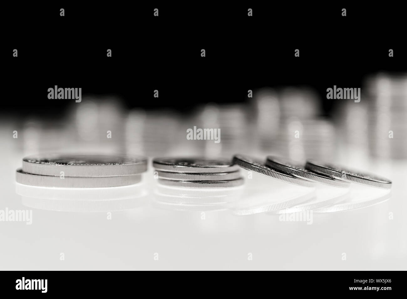 Stack of silver coins macro. Rows of coins for finance and banking concept. Trade in precious metals Stock Photo