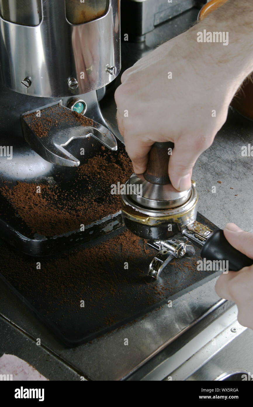 Tamping Espresso Grounds Stock Photo