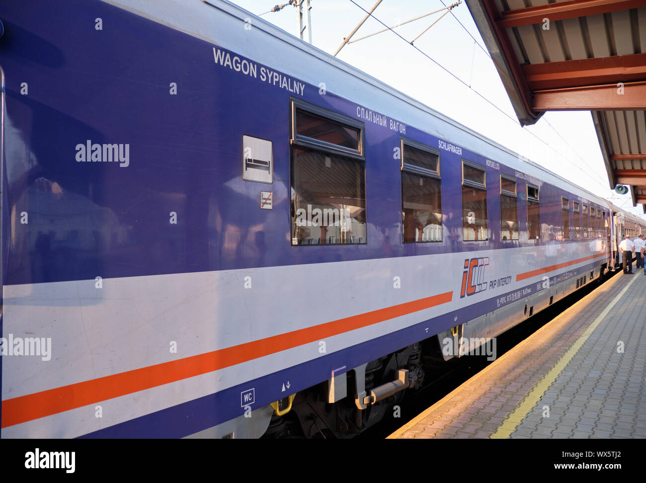 Przemysl, Poland, August 31, 2019.  PKP Intercity Polish train sleeping car at station platform awaiting departure in late afternoon Stock Photo