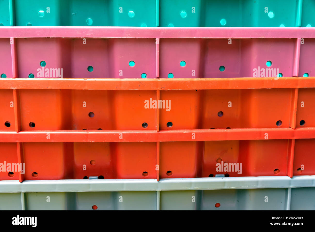 A close up of a stack of plastic bins are used to transport food at Vancouver's Granville Island Market. Stock Photo