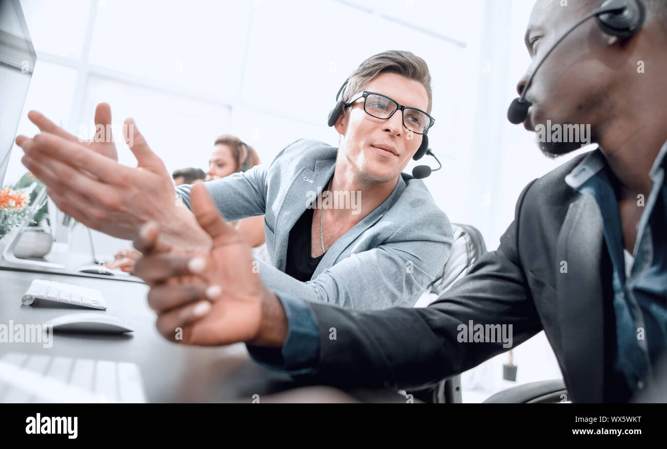 operators of the call center discussing operational issues. photo with ...