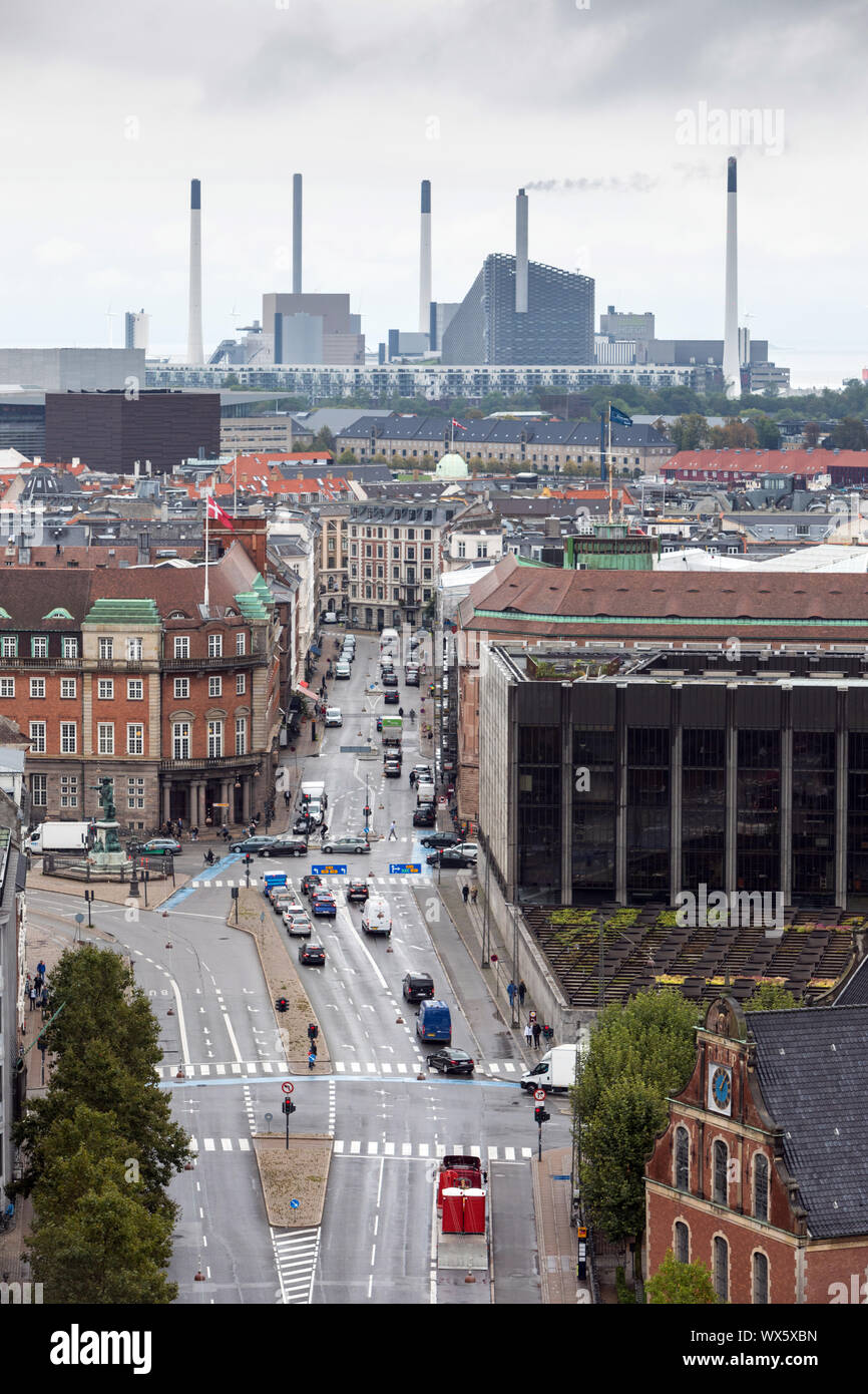 Looking down Holmens Kanal in Copenhagen, with the Amager Bakke combined incinerator plant and ski slope in the far distance. Danish National Bank (r) Stock Photo