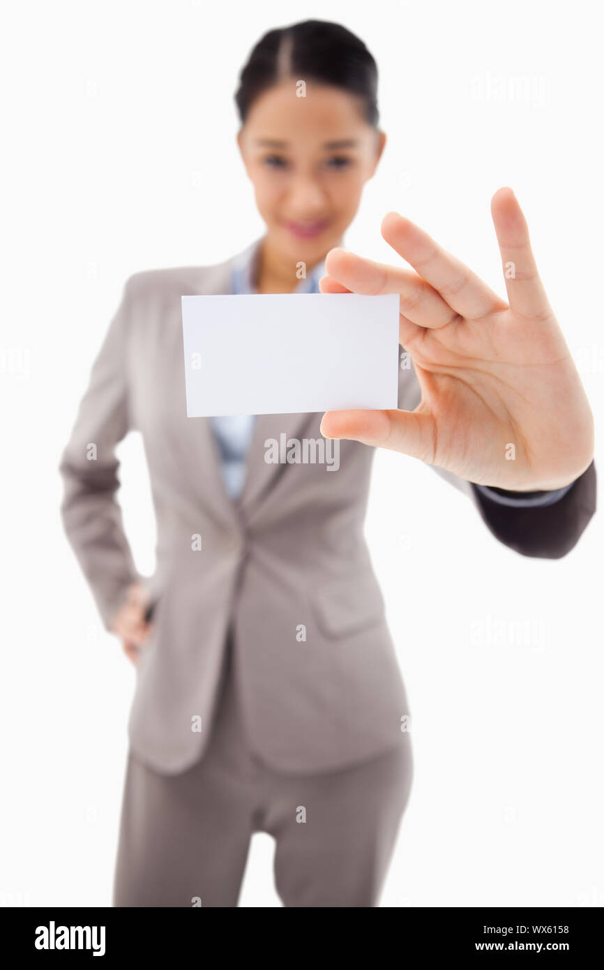Portrait of a cute businesswoman showing a blank business card against a white background Stock ...