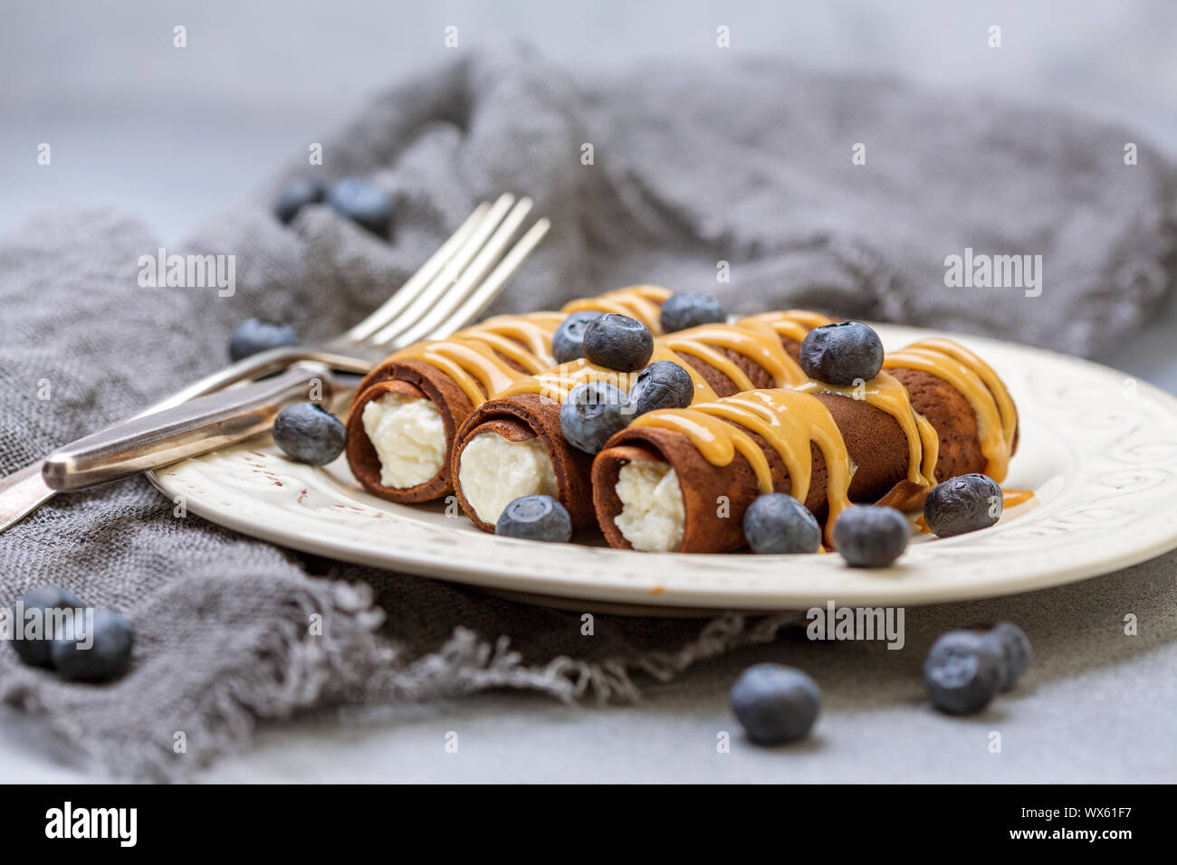 Chocolate crepes with cottage cheese filling Stock Photo Alamy
