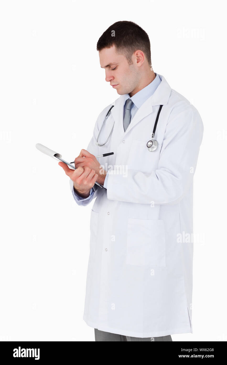 Doctor carefully taking notes hi-res stock photography and images - Alamy